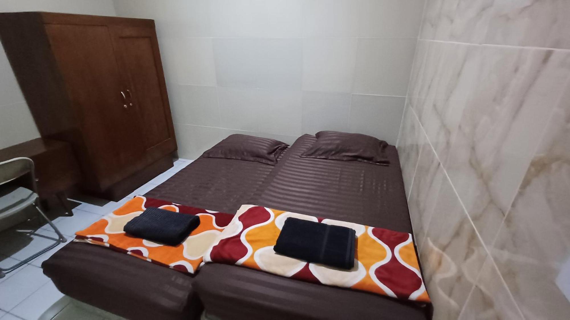 Kost Carmelia Syariah Baranangsiang Hotel